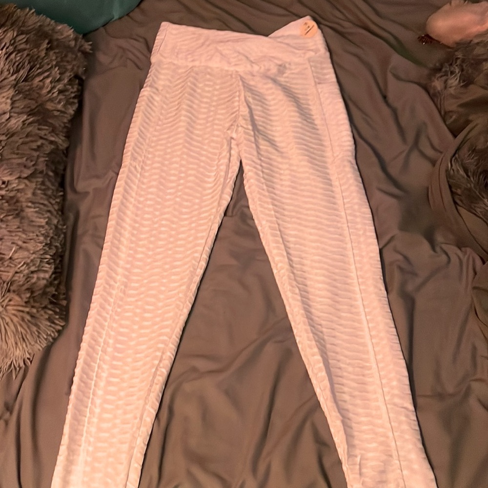 White slim fit pants to give plump butt